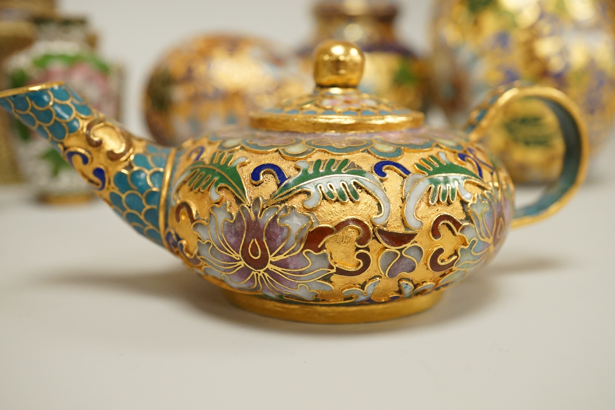A collection of miniature enamel and cloisonné boxes, eggs and a painted rabbit, etc. (11)